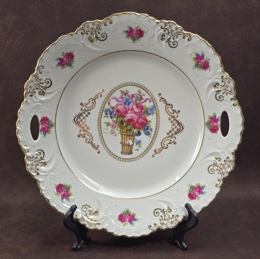 1930er Prunkteller von Urbach-Freres – Porzellan, Goldrand, Rosendekor & Durchbrüche. Motiv berieben, aber wunderbar dekorativ!