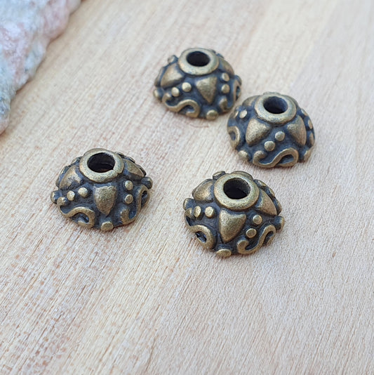 8 Perlenkappen 9mm, antik bronzefarbig