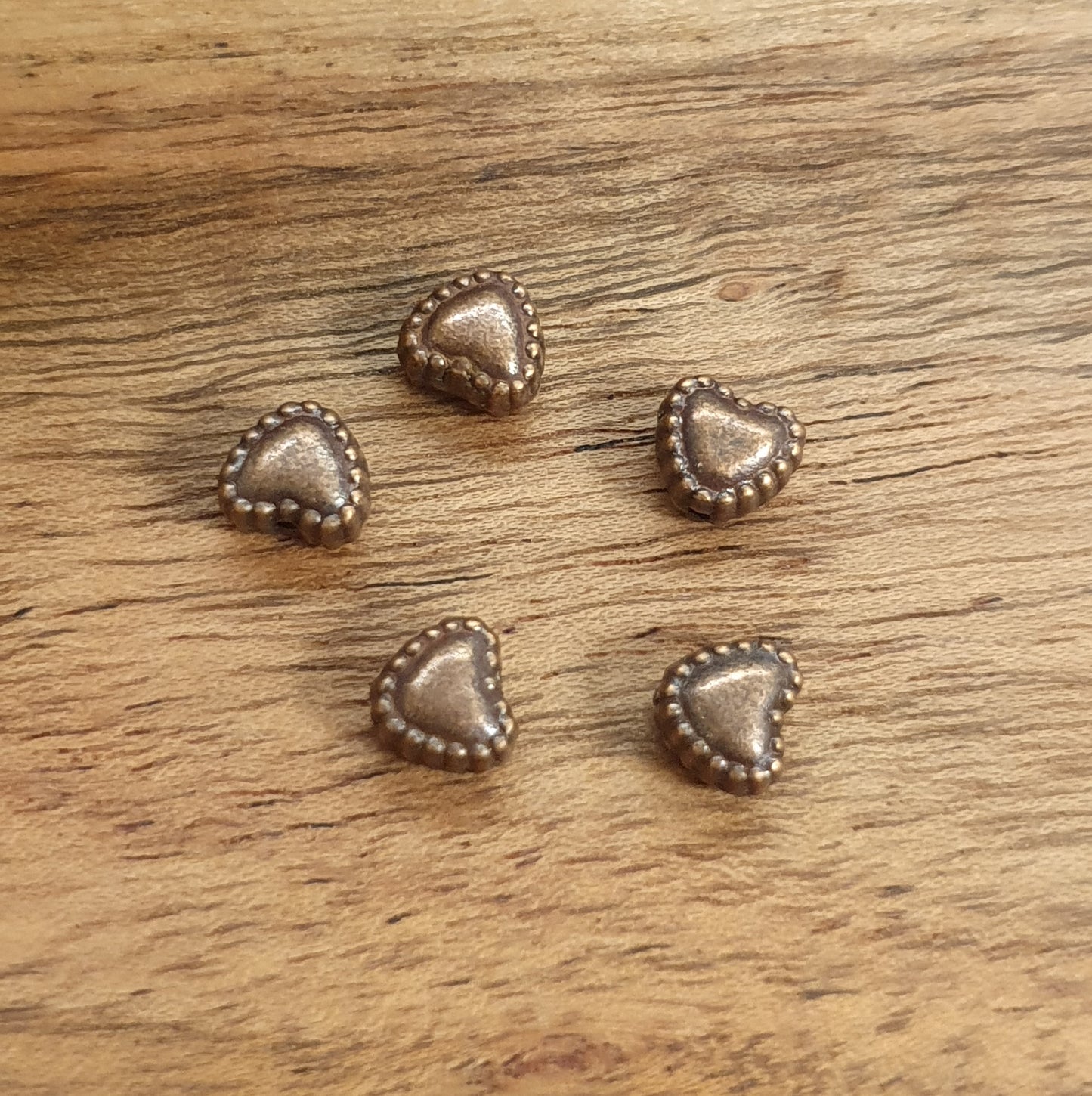 15 kleine Metallperlen Herz in antik kupferfarbig, 5mm