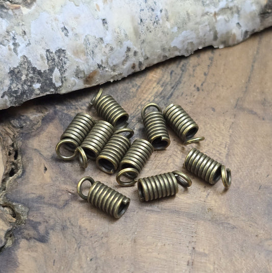 Das Bild zeigt 10 Bandenden/Kordelenden Spirale für 2,5mm Band - antik bronzefarbig