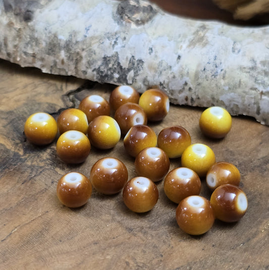 Das Bild zeigt Glasperlen in Ombre-Optik. Ombre kommt aus dem Französischen und bedeutet „Schatten“ oder „Verlauf“.