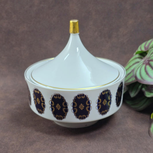 Vintage-Porzellandose von Volkstedt mit Echt-Kobalt und Goldverzierung. Ø 14 cm, guter Zustand mit Chip – ideal als Sammler- oder Schmuckdose.