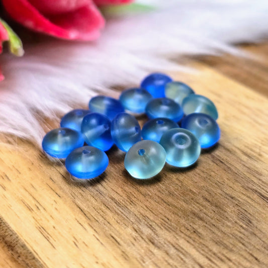15 hochwertige Ufo-Perlen aus böhmischem Glas in changierendem Lagunenblau-Grün – ideal für DIY-Ketten, Armbänder und Ohrringe. Maße: 7,4 x 4,2 mm – handmade look!