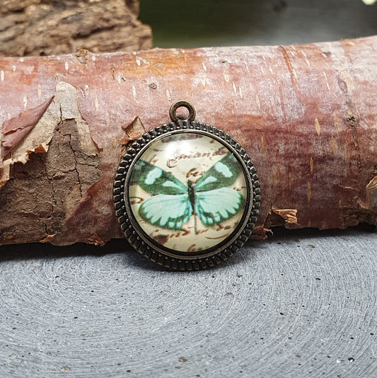 Anhänger mit Cabochon aus Glas, Schmetterling, antik bronzefarbig