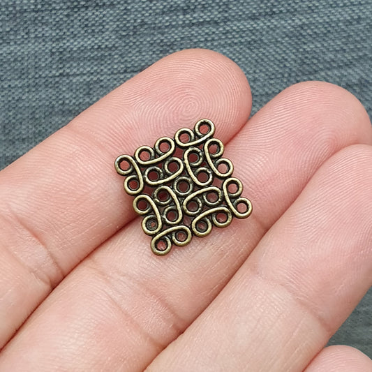 2 Verbinder, Schnörkel, 21x21mm, antik bronzefarbig