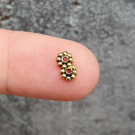 20 Spacer Daisy mit 2 Löchern, 7x4mm, antik goldfarbig