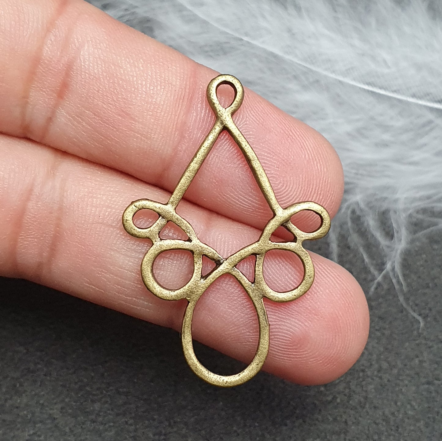 2 Verbinder Schnörkel, 38mm, antik bronzefarbig