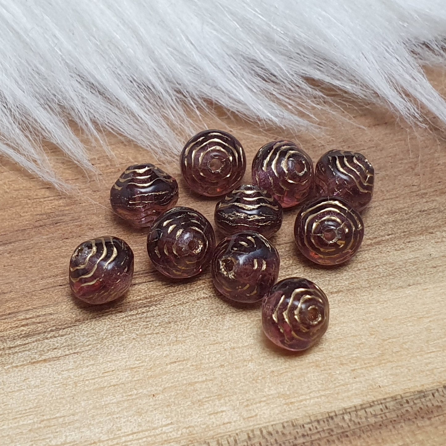 10 gerillte Glasperlen aus Gablonz amethystfarbig, 6mm, bikonisch