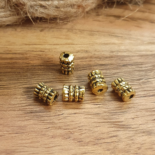 5 walzenförmige Metallperlen, antik goldfabig, 6mm