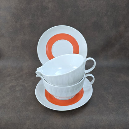 Zweier-Set Thomas Lanzette Saucieren aus den 1970ern mit Untertellern und kräftigem Pop-Art-Dekor in Orange.