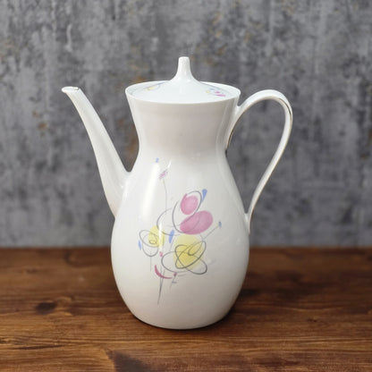 Mid-Century Kaffeekanne von Schirnding Bavaria aus weißem Porzellan mit pastellfarbenem Atomic-Dekor und zarter Goldlinie, ca. 1955–1965.