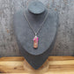 Handgefertigter Anhänger aus pink/orangem Achat, mit Schlüßel, an Edelstahlkette